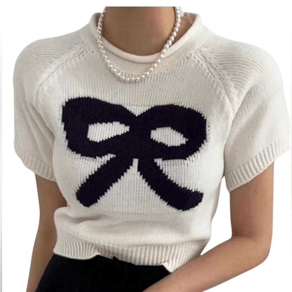 NWOT Cream Sweater with Black Bow Design